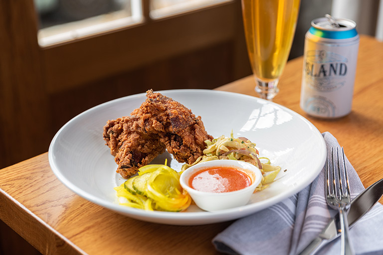 Charleston Sunday brunch dishes including fried chicken with housemade hot sauce
